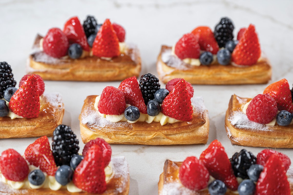 Assortment of Very Berry Pastries, Pastry baked with custard cream, topped with lemon cream and fresh berries