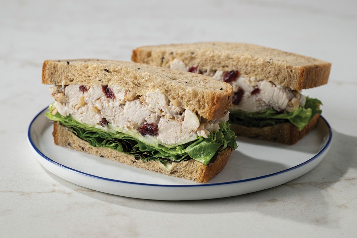 Harvest Chicken Salad Sandwich With Cucumber and Crisp Lettuce on Multigrain Bread