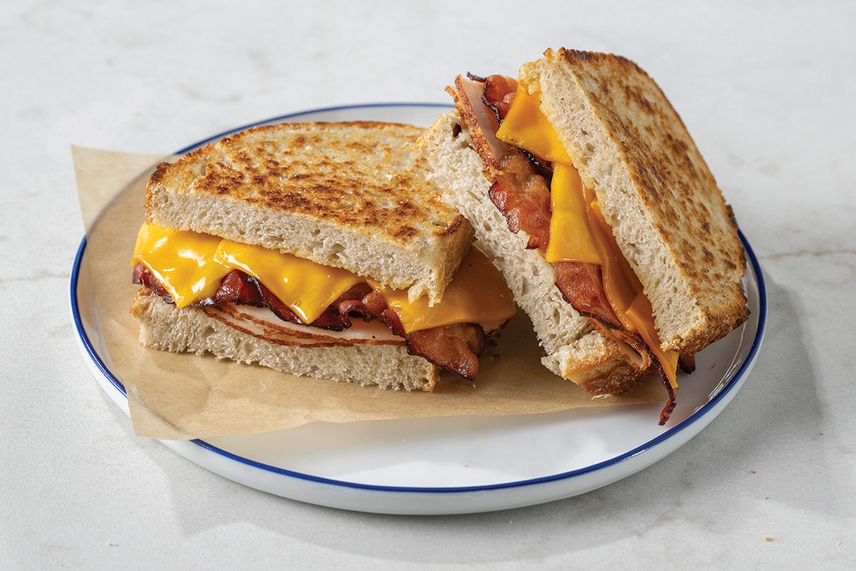 Sourdough Turkey Melt with Bacon Cut in Half and Plated